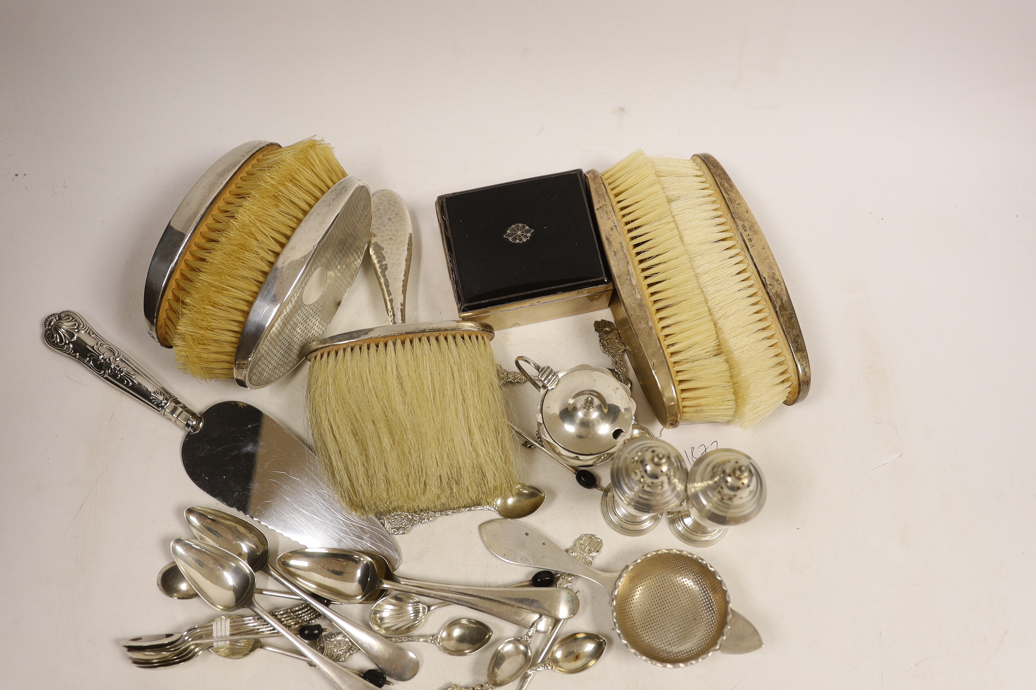 Sundry small silver including flatware, mounted clothes brushes, condiments and mounted cigarette box.